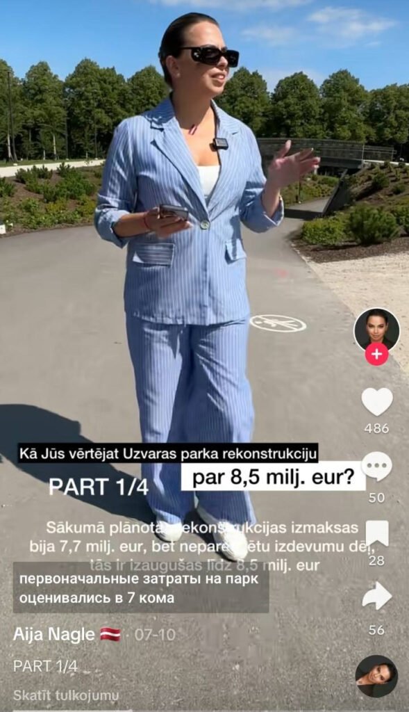 Tvērums no TikTok video, kurā Aija Nagle stāv Uzvaras parka teritorijā. Uz attēla redzams uzraksts: "Kā jūs vērtējat Uzvaras parka rekonstrukciju par 8,5 milj. eur?"